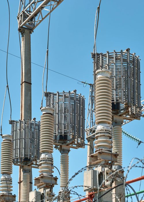 High voltage electrical transformers in an electricity distribution power plant. Close-up